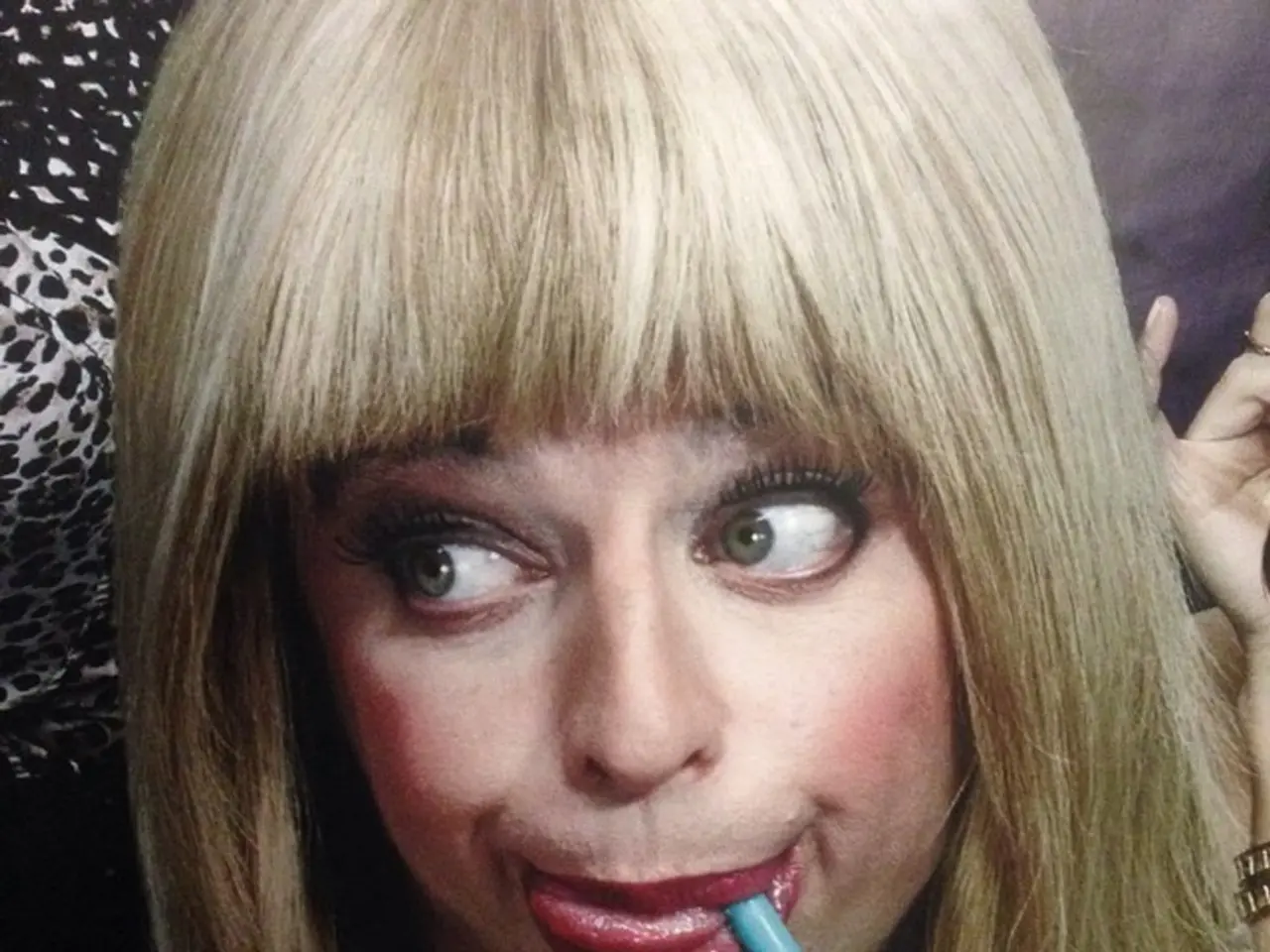 This picture describes about group of people, in the middle of the image we can see a woman, she is...