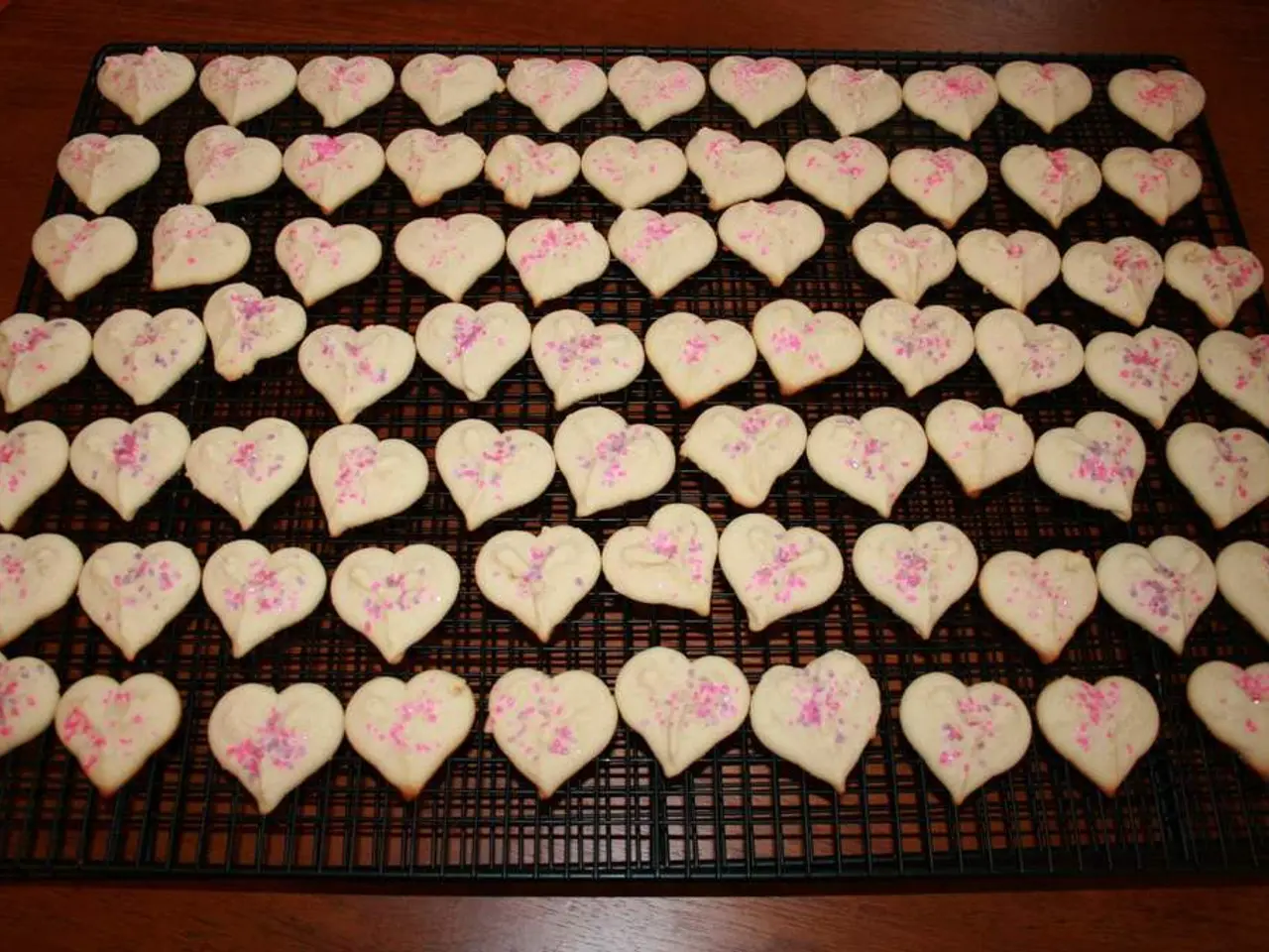 In this image, I can see cookies on a grill kept on the floor. This picture might be taken in a...