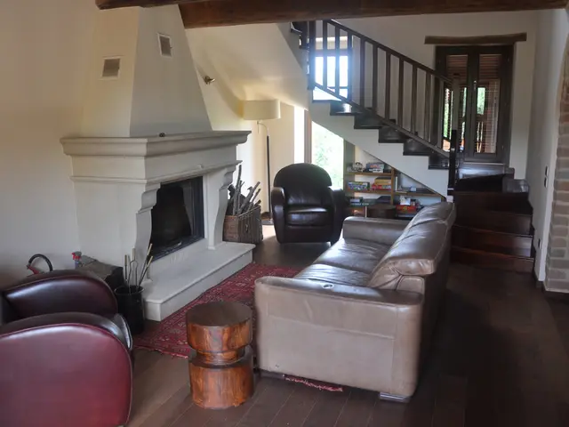 This is a room. There is a sofa chair, table and bonfire. There is a box near to that. In side that...